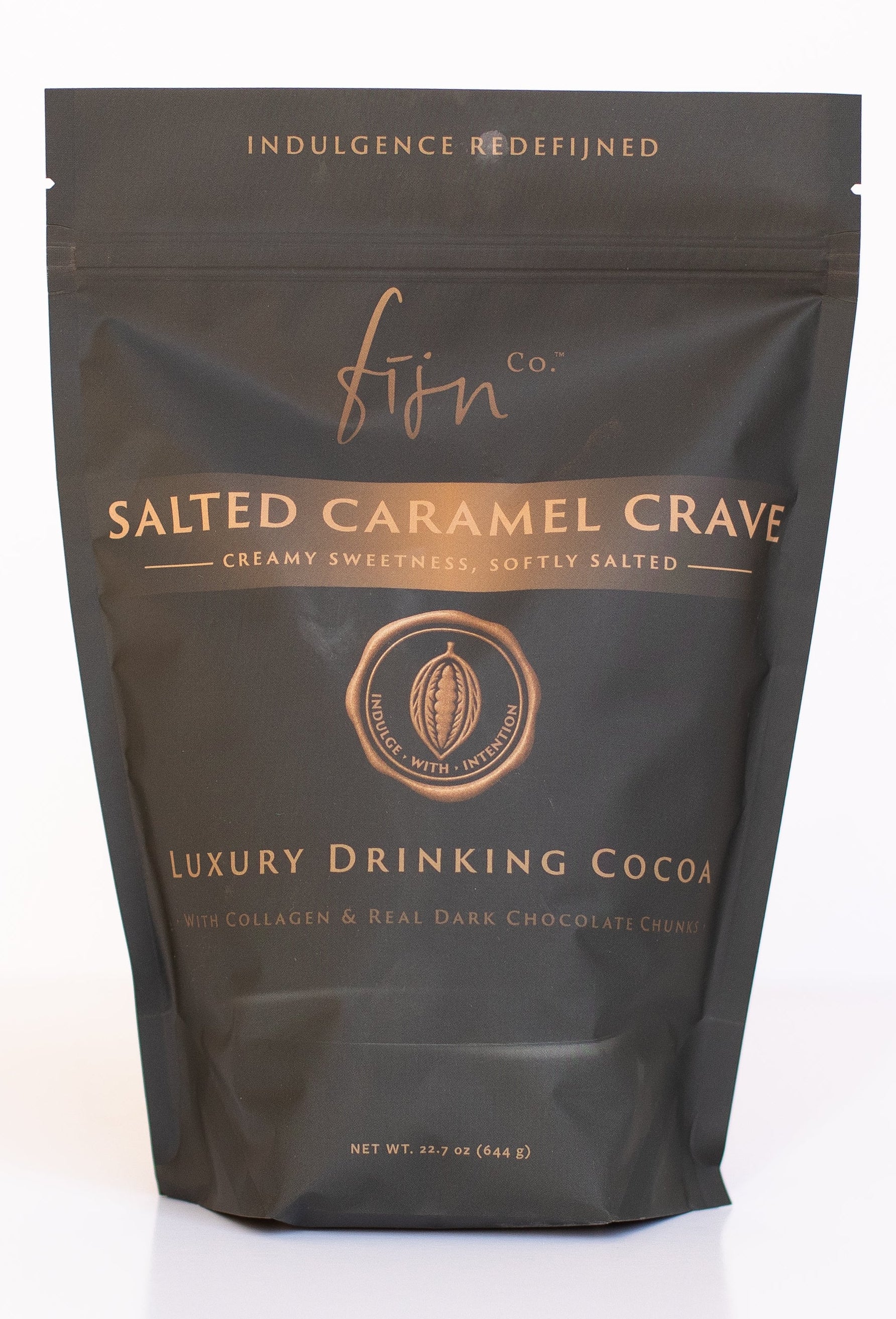 Dark packaging of 'Salted Caramel Crave' luxury drinking cocoa with gold text on a white background.